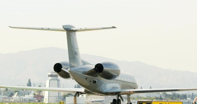 Panning A Rear View Of A Luxury Gulfstream Private Jet At Van Nuys Airport - Los Angeles, California