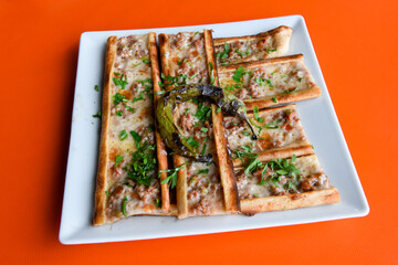 Turkish pita with minced cubed meat and cheese (Turkish name: Kiyma Kusbasi kasarli pide)