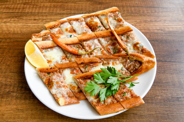 Turkish pita with minced cubed meat and cheese (Turkish name: Kiyma Kusbasi kasarli pide)