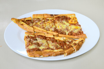 Turkish pita with minced cubed meat and cheese (Turkish name: Kiyma Kusbasi kasarli pide)