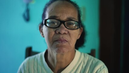 An African American senior woman portrait closeup face. A black elderly hispanic person