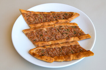 Turkish pita with minced cubed meat and cheese (Turkish name: Kiyma Kusbasi kasarli pide)
