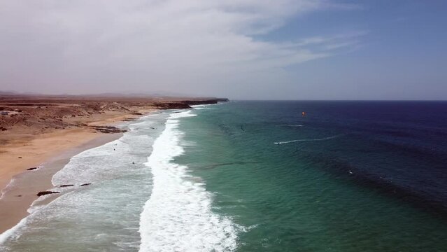 Aerial drone footage of kitesurfers at Cotillo beach, Fuerteventura, Spain