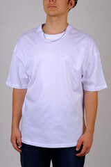 Close up pattern of cotton man in white t-shirt isolated on gray background.