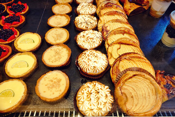 Selective focus of various breakfast pastries in a bakery shop. 