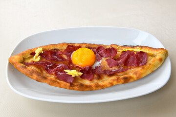 Turkish pita with minced cubed meat and cheese (Turkish name: Kiyma Kusbasi kasarli pide)