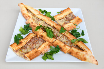 Turkish pita with minced cubed meat and cheese (Turkish name: Kiyma Kusbasi kasarli pide)