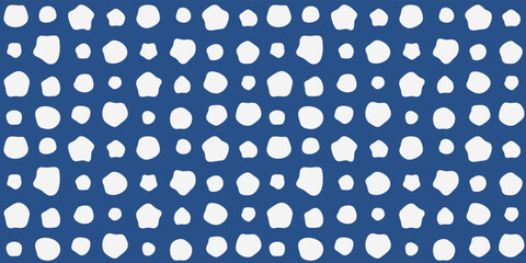Blue background and white roundness. Vector hand drawn white dot pattern.