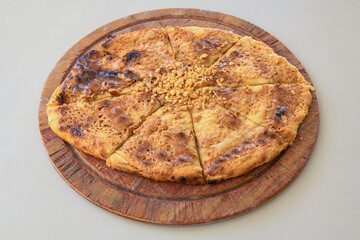 On the table, pita bread with honey, walnuts and tahini. Tahinli , ceviz ve balli pide.