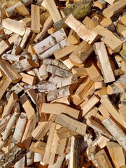 Close-up of chopped firewood in a pile. Firewood background.