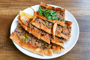 Turkish pita with minced cubed meat and cheese (Turkish name: Kiyma Kusbasi kasarli pide)