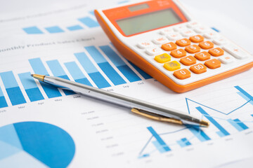 Calculator on chart and graph spreadsheet paper. Finance development, Banking Account, Statistics, Investment Analytic research data economy, Stock exchange trading, Business company concept.