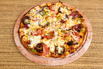 DelicioDelicious mixed pizza with rich content. Menu concept of choice and diversity. Karisik pizzaus mixed pizza with rich content. Menu concept of choice and diversity