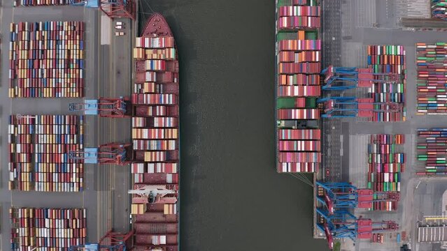 Aerial view directly above the cranes and loaded cargo ships at Container Terminal in the Port of Hamburg (Hamburger Hafen)