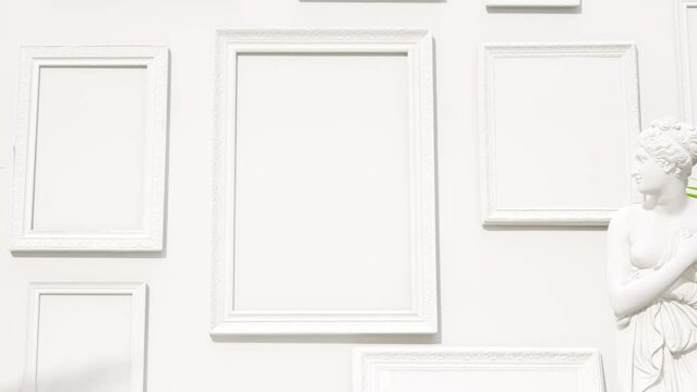 interior mockup picture frames on the white wall background, antique statue andtropical house plants ,minimalism