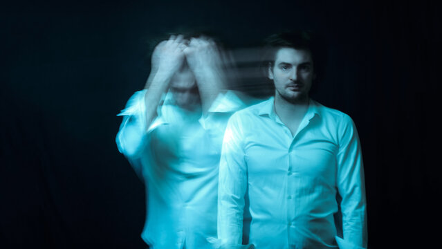 schizophrenic abstract blurry portrait of man with mental disorders and mental illnesses on dark background
