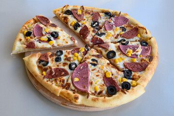 Delicious mixed pizza with rich content. Menu concept of choice and diversity