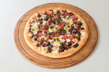 Delicious mixed pizza with rich content. Menu concept of choice and diversity