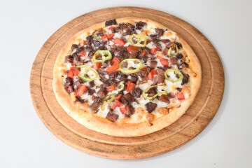 Delicious mixed pizza with rich content. Menu concept of choice and diversity