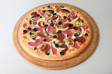 Delicious mixed pizza with rich content. Menu concept of choice and diversity