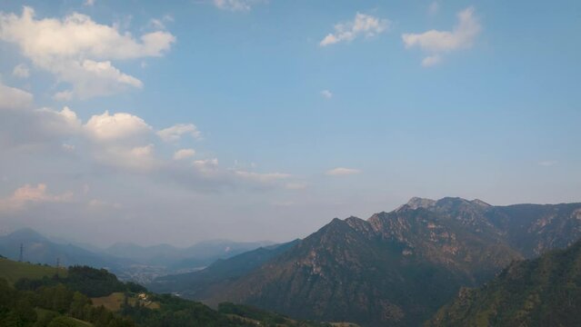 Timelapse of the Seriana valley and its mountains at evening, Orobie Alps, Bergamo, Italy