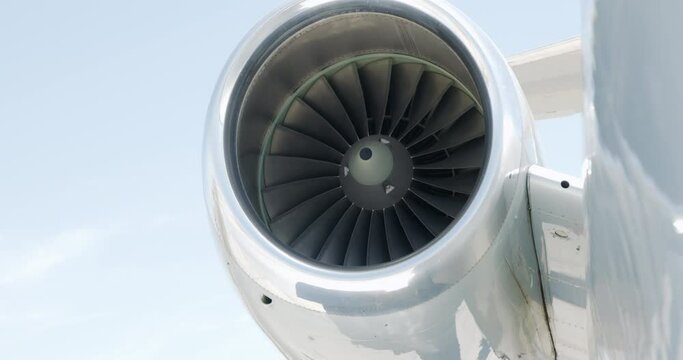 Close-Up Slow Motion Pan Of A Spinning Jet Engine Turbine And Blades - Los Angeles, California
