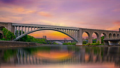 Bridge at vibrant sunset, New York City, United States