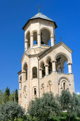 Fototapeta na wymiar The bell tower of the Holy Trinity Cathedral (eastern façade) in Tbilisi, Georgia