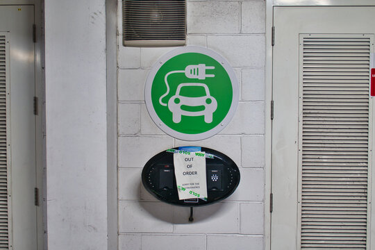A sign on an electric vehicle (EV) charging point says that it is out of order. Taken in the car park of a branch of the UK ASDA supermarket.