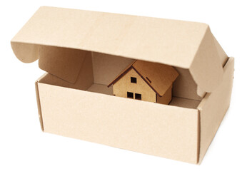 Opened shipping box with a small house inside