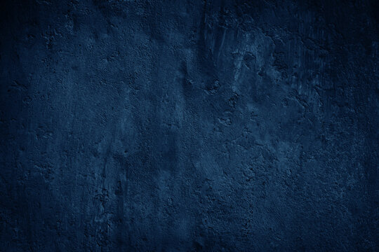 Navy blue texture. Close-up.Toned old concrete surface. Dark grunge background with space for design.