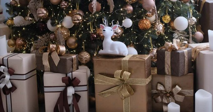 Christmas decorations and boxes with xmax presents. Lots of gifts under Christmas tree. New year time