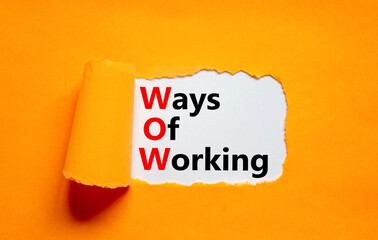 WOW ways of working symbol. Concept words WOW ways of working on white paper on a beautiful orange...