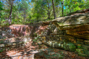 Fototapeta premium Old stone work on a forest hillside