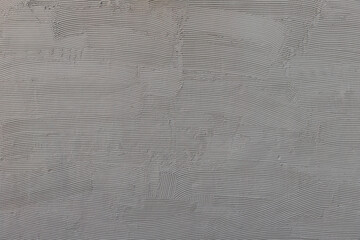 Fototapeta na wymiar wallcovering texture with wavy putty