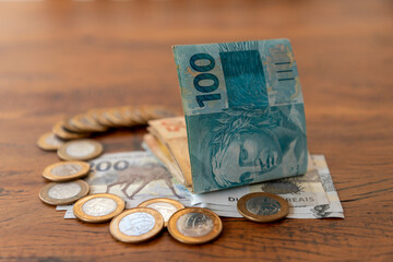 Brazilian money in banknotes and coins on the table