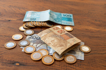 Brazilian money in banknotes and coins on the table