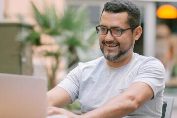 handsome young entrepreneur working from cafe