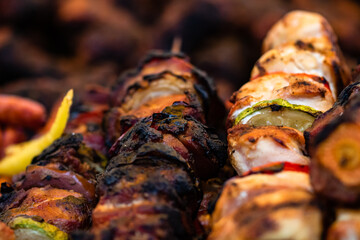Grilling tasty food on barbecue. Steak, sausages on grill at food festival
