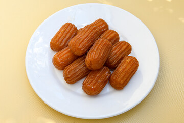 Turkish Dessert Sobiyet, havuc dilimi, midye baklava, mussels baklava and classic baklava with Pistachio . Cikoltali cevizli, fistikli soguk Baklava, top view. Karisik Turk tatlilari.