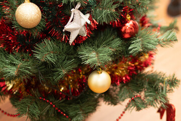 Christmas fir tree with toys stars and balls