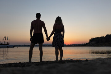 couple on the beach at sunset
