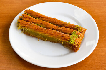 Turkish Dessert Sobiyet  Baklava, mussels baklava and classic baklava with Pistachio . Cevizli, Fistikli Baklava, top view.