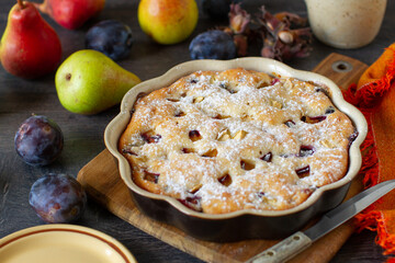 Homemade cake with apples, plums, pears and other traditional ingredients