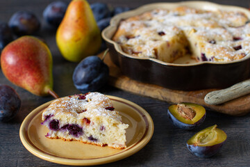Homemade cake with apples, plums, pears and other traditional ingredients
