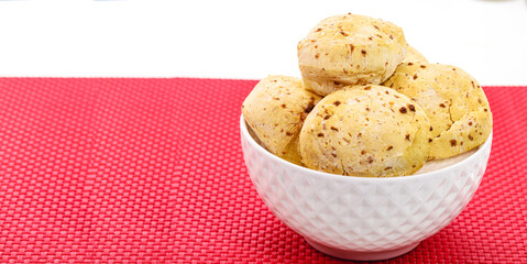 cheese bread, served hot, typical Brazilian food, Minas Gerais, with copy space, white background