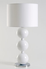 Modern white lamp with balls design and a straight lamp shade, isolated on white
