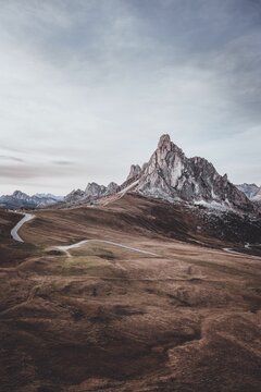 Vertical view of Giau Pass mountain in Italy and the roads taking the visitors there