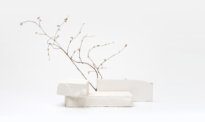 Stack stones platform podium and twig on gray light copy spase background. Minimal empty display...