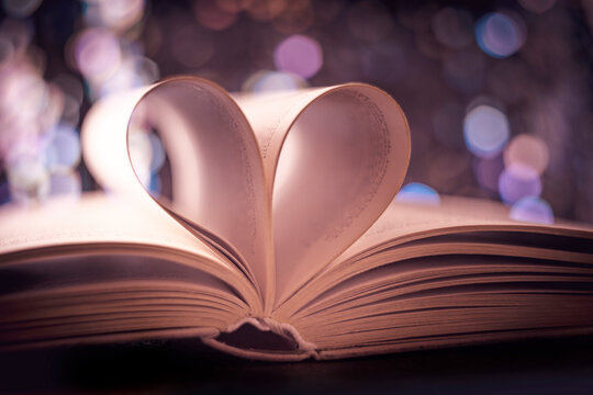 Heart from book pages., vintage photo style with bokeh background